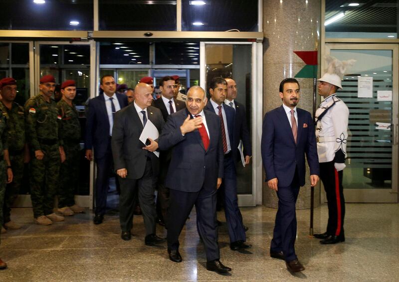 FILE PHOTO: Iraq's Prime Minister-designate Adel Abdul Mahdi and the speaker of Iraq's parliament Mohammed al-Halbousi arrive at the parliament building in Baghdad, Iraq, October 24, 2018. REUTERS/Khalid al Mousily/File Photo