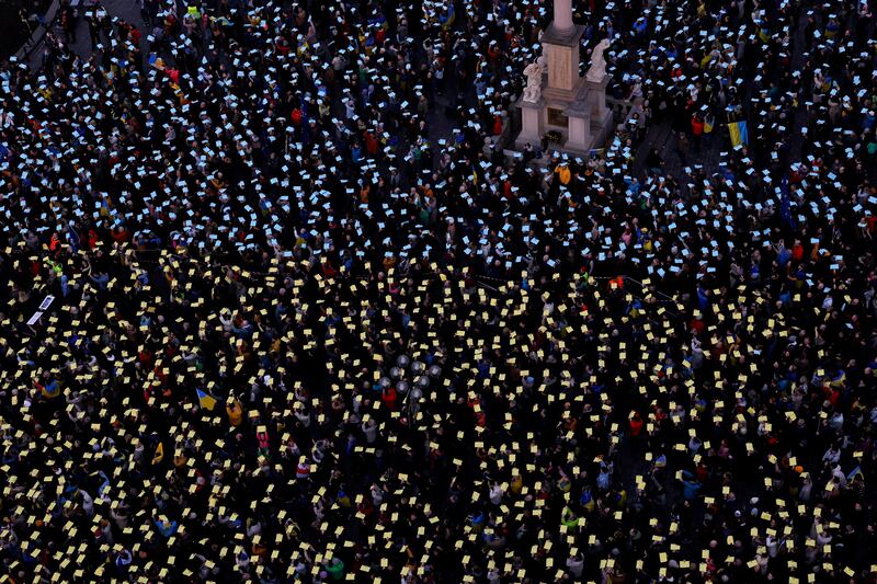 People attend a protest to mark the two-year anniversary of the Russian invasion of Ukraine, at the Old Town Square in Prague, Czech Republic. Reuters