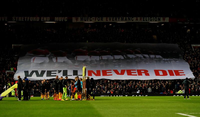 General view as Manchester United fans display a banner to mark the anniversary of the Munich air disaster before the match against Wolves at Old Trafford. Reuters