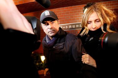 Former Nissan chairman Carlos Ghosn accompanied by his wife Carole Ghosn, arrives at his place of residence in Tokyo, Japan, prior to his re-arrest. Reuters