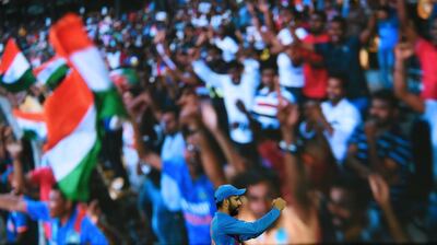 Indian captain Rohit Sharma celebrates after he dismissed Bangladeshi cricketer Mushfiqur Rahim during the final Twenty20 international cricket match between Bangladesh and India of the Nidahas Trophy tri-nation Twenty20 tournament at the R. Premadasa stadium in Colombo on March 18, 2018. / AFP PHOTO / Ishara S. KODIKARA