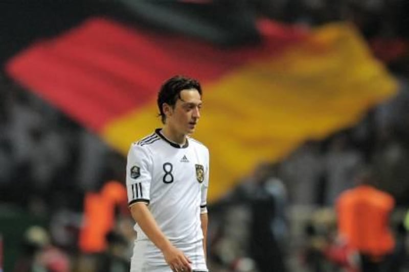Germany's midfielder Mesut Oezil walks after scoring during the Euro 2012 qualifying group A football match between Germany and Turkey at the Olympia stadium in Berlin on October 8, 2010. AFP PHOTO / ROBERT MICHAEL