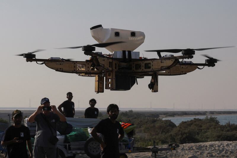 A drone plants mangrove seedlings in Abu Dhabi last October. AI-equipped drones play a role in reforesting areas. Reuters