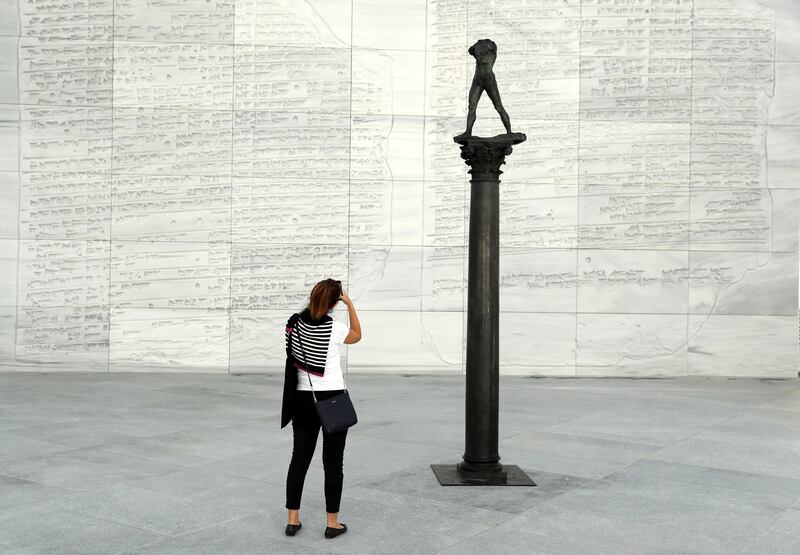 Abu Dhabi, United Arab Emirates - November 6th, 2017: Piece: Walking man of a column at the Louvre. Louvre Media Day. Monday, November 6th, 2017 at Louvre, Abu Dhabi. Chris Whiteoak / The National