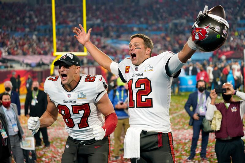 Tampa Bay Buccaneers quarterback Tom Brady and tight end Rob Gronkowski celebrate after beating Kansas City Chiefs to win the Super Bowl in 2021. AP