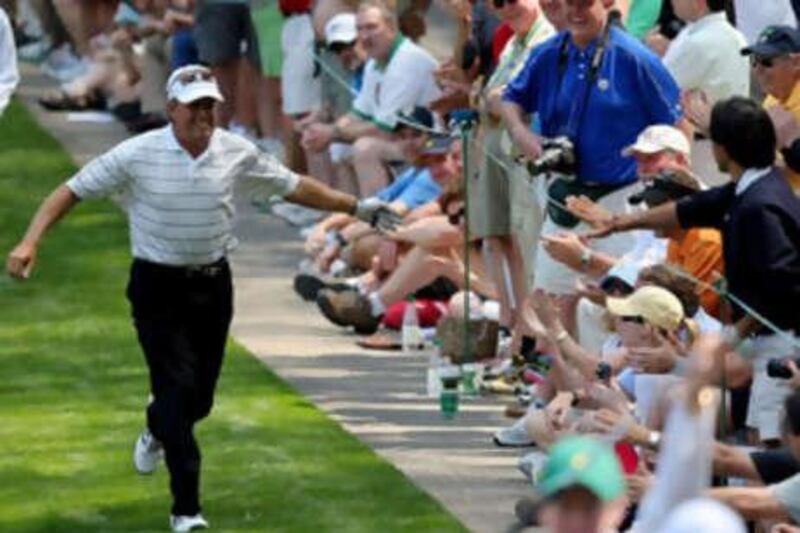 Wayne Grady celebrates after hitting a hole in one before this year's Masters tournament at Augusta.