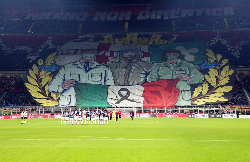 AC Milan supporters display a banner in memory of Covid-19 victims during an Italian Serie A football match in the Italian city. EPA