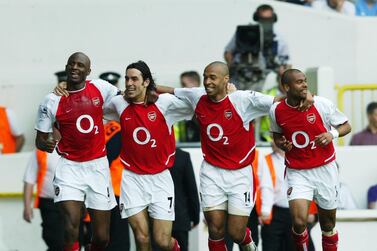 Patrick Vieira, Robert Pires, Thierry Henry and Ashley Cole of Arsenal celebrate after the second goal during their match at Tottenham  on April 25, 2004. Getty