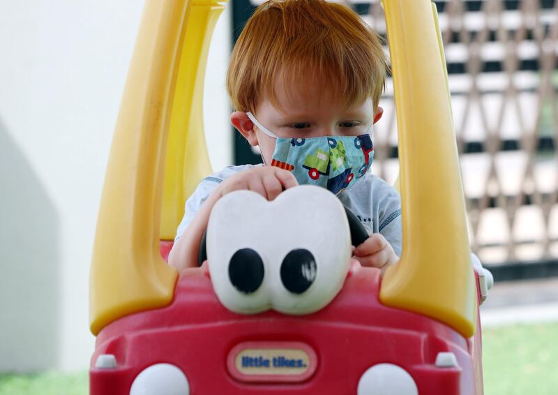 Dubai, United Arab Emirates - Reporter: Kelly Clarke. Coronavirus/Covid-19. Charlie aged 3 plays in his Little tykes car with his PPE mask on. Sunday, August 23rd, 2020. Dubai. Chris Whiteoak / The National