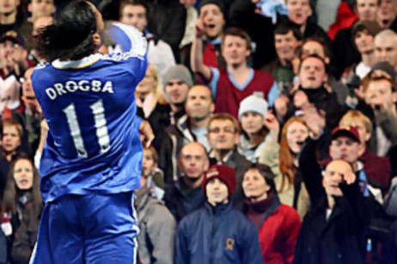 Didier Drogba throws an object back into the crowd during Chelsea's Carling Cup tie against Burnley.
