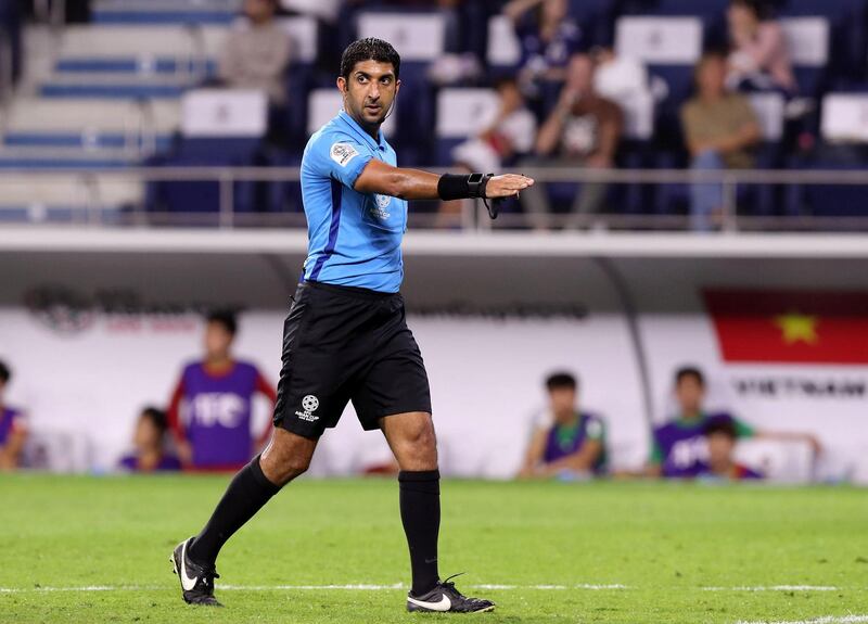 Dubai, United Arab Emirates - January 24, 2019: Ref Mohammed Abdulla Hassan of the UAE points to the spot after a VAR decision during the quarterfinal game between Japan and Vietnam in the Asian Cup 2019. Thursday, January 24th, 2019 at Al Maktoum Stadium, Dubai. Chris Whiteoak/The National