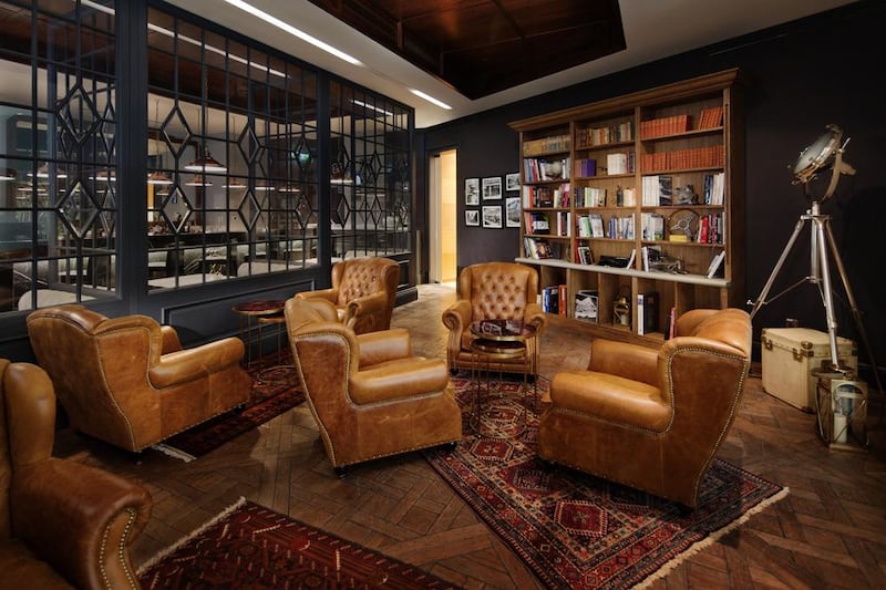 The cigar lounge immediately on entry is lifted straight from a London gentleman’s club at the height of empire – all brown leather, dark wood and dusty bookshelves. Courtesy Alfie’s / Jumeirah Emirates Towers Hotel