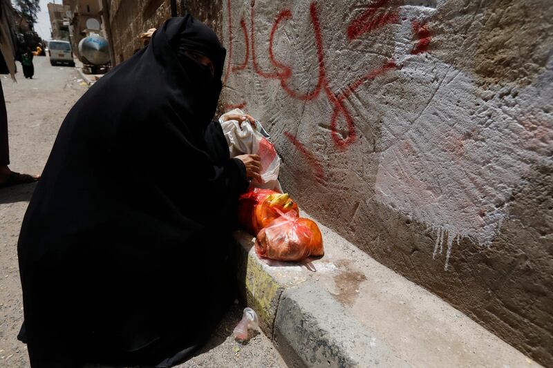 A Yemeni woman is among those who received rations from the charity group. EPA
