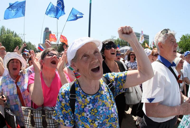 Left, supporters of the ‘People’s Republic of Donetsk’, a group of pro-Russian separatists in the eastern Ukrainian city of Donetsk earlier this month. Alexander Khudoteply / AFP / May 2014