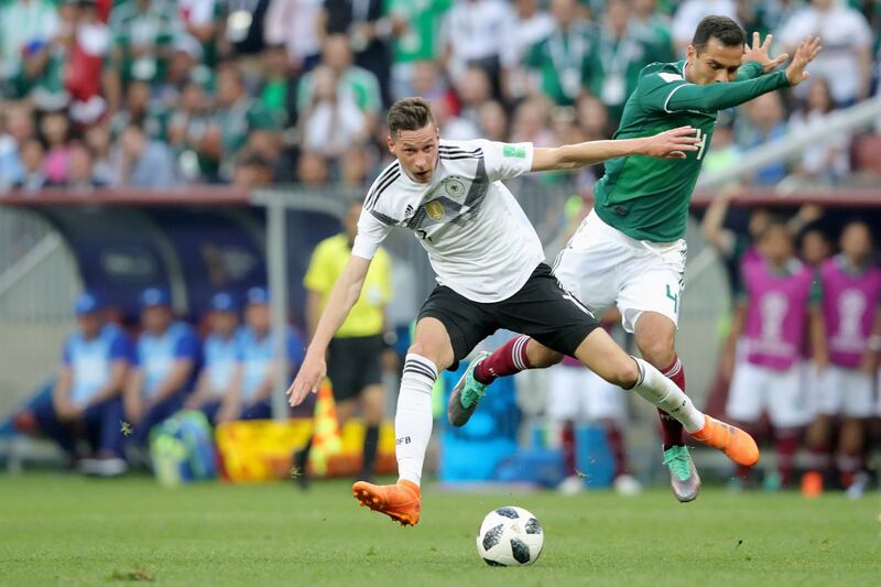 MOSCOW, RUSSIA - JUNE 17:  Julian Draxler of Germany battles for the ball with Rafael Marquez of Mexico during the 2018 FIFA World Cup Russia group F match between Germany and Mexico at Luzhniki Stadium on June 17, 2018 in Moscow, Russia.  (Photo by Alexander Hassenstein/Getty Images)