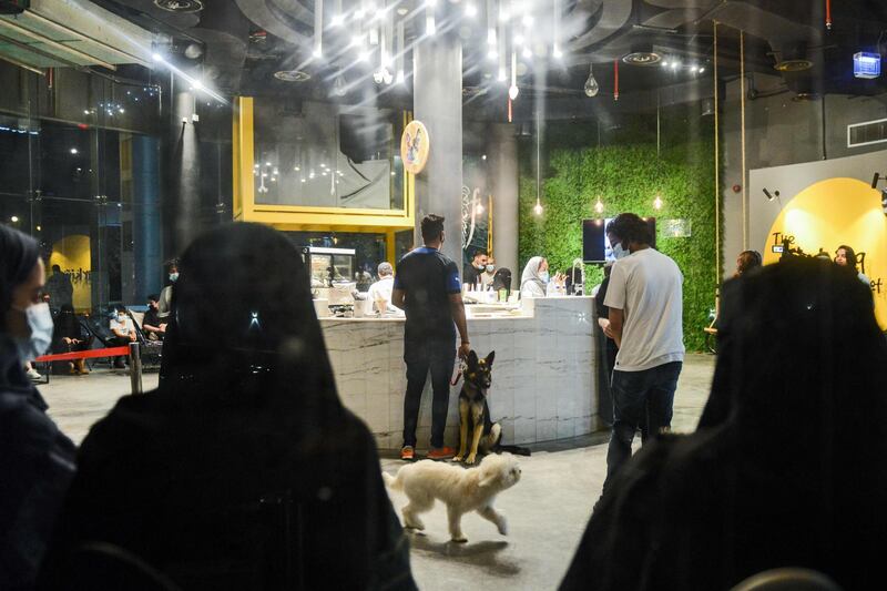 Dog owners place orders at the Barking Lot cafe. AFP