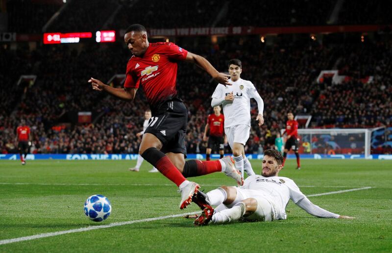 Manchester United's Anthony Martial skips over a challenge. Reuters