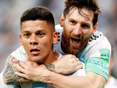 Lionel Messi, right, celebrates with Argentina matchwinner Marcos Rojo. EPA