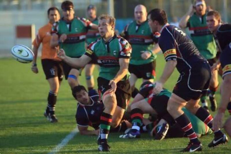 Abu Dhabi Harlequins, in green, topped the Jebel Ali Dragons 17-5, on February 15, and they meet again in today’s West Asia final. Ravindranath K / The National