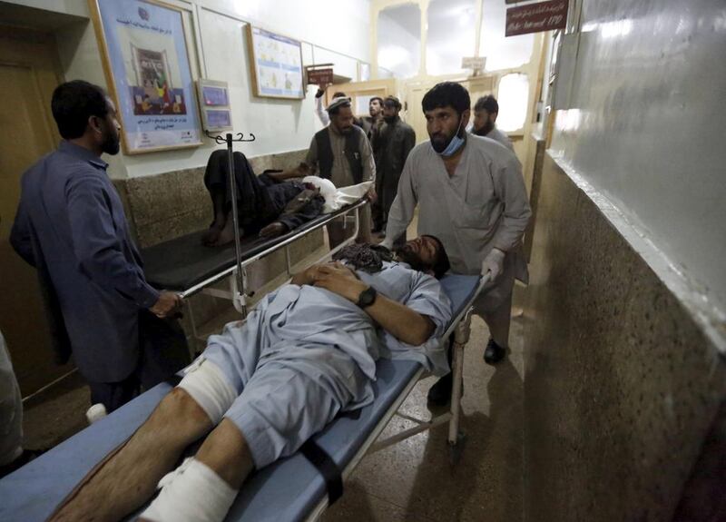 Injured men are brought to a hospital for treatment after a suicide bombing in Asadabad, capital of Afghanistan’s Kunar province, on February 27, 2016. Parwiz / Reuters