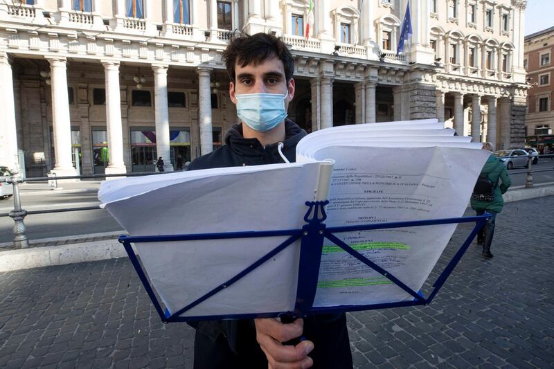 Filippo Cardelli, student of law, reads the Italian Constitution as a form of protest in Rome, Italy. EPA