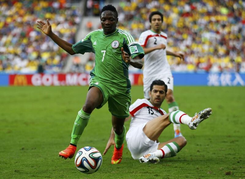 Nigeria's Ahmed Musa controls the ball past Iran's Pejman Montazeri during their 2014 World Cup Group F match in Curitiba, Brazil on Monday. Ivan Alvarado / Reuters