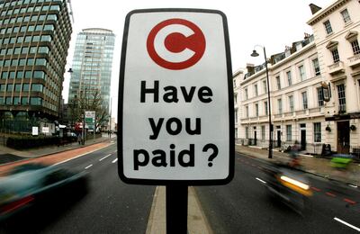 FILE PHOTO: A road sign marks the start of the congestion charge area, which is managed by Capita, in London, Britain February 19, 2007.  REUTERS/Alessia Pierdomenico/File Photo