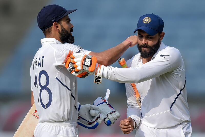 India's captain Virat Kohli, left,  and Ravindra Jadeja after declaring on 601-5. AFP