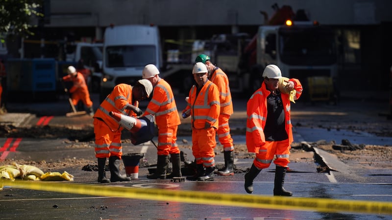 Thames Water officials work in Holloway. PA