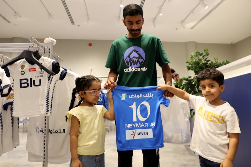 Fans with a Neymar Al Hilal shirt at the club shop in Riyadh. Reuters
