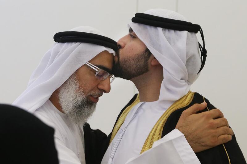 Abdulla congratulates his son, Mohammad Abdulla who graduated from the Class of 2014. Delores Johnson / The National