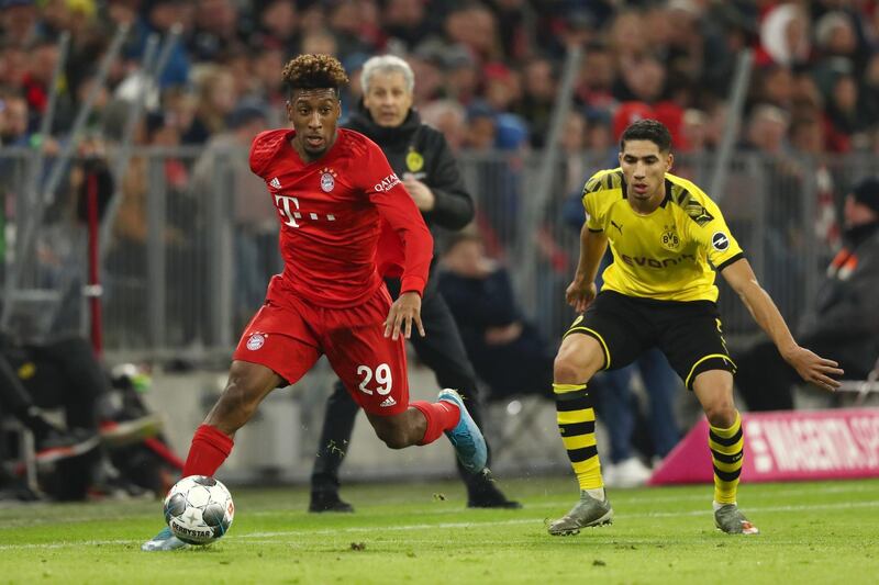 Bayern Munich winger Kingsley Coman runs with the ball under pressure from Achraf Hakimi. Getty Images