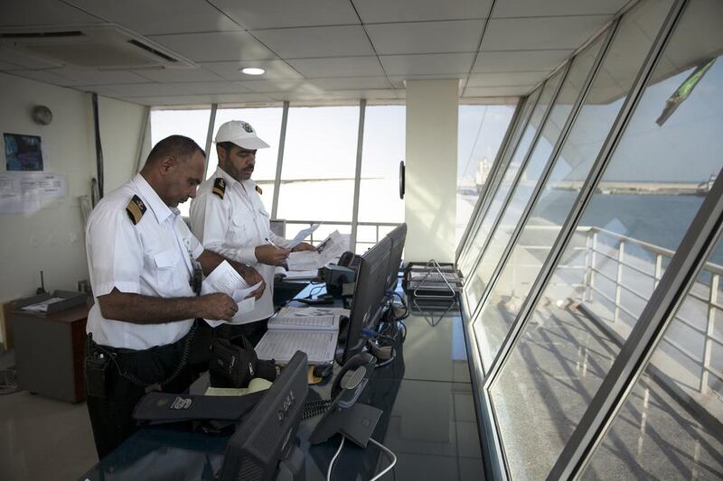 Vessel Traffic Services (VTS) operator Mahmoud Twfiq monitors the incoming ships at Port Zayed. Silvia Razgova / The National