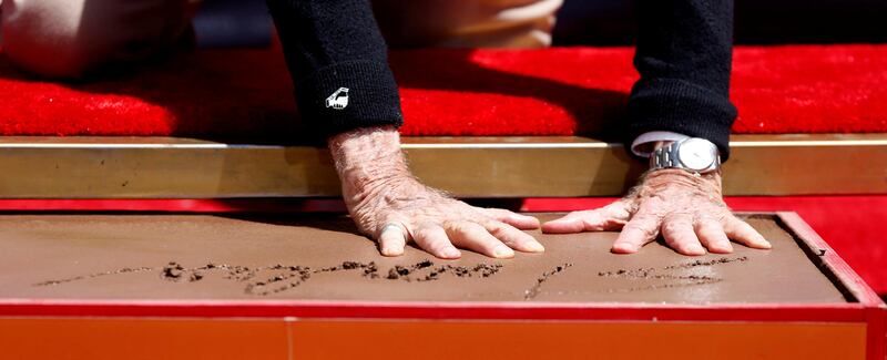 Marvel Comics co-creator Stan Lee places his handprints in cement during a ceremony in the forecourt of the TCL Chinese theatre. Mario Anzuoni / Reuters