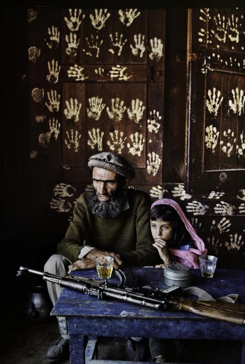 Father and daughter at home in Nuristan, 1992. Copyright ©Steve McCurry / Magnum Photos 
