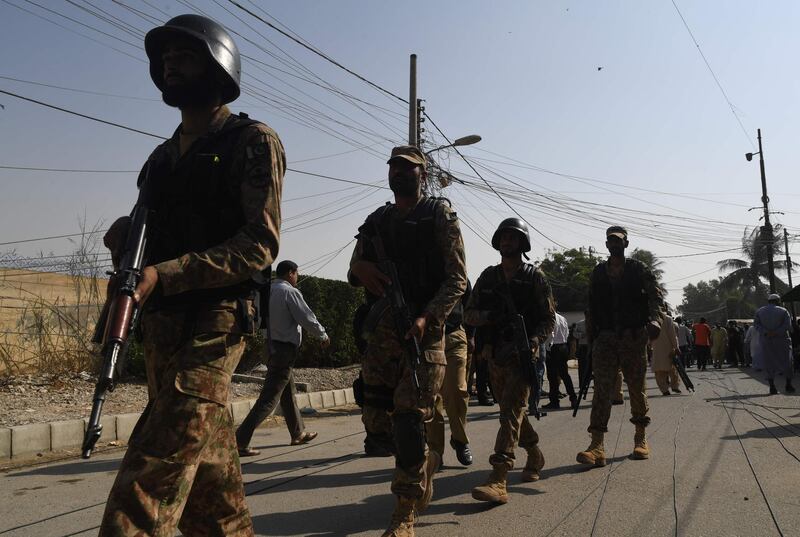 Pakistani soldiers patrol outside the Chinese consulate in Karachi after an attack. AFP