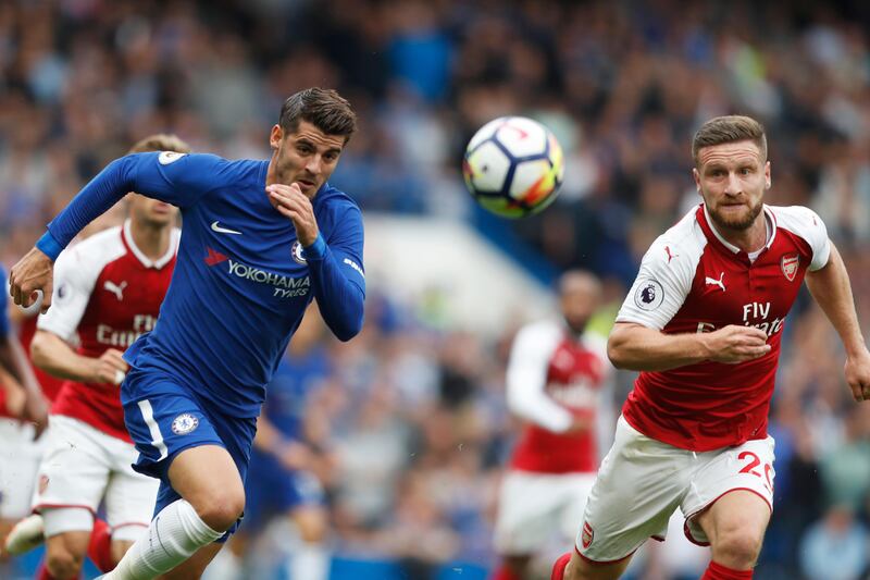 Chelsea's Alvaro Morata, left, and Arsenal's Shkodran Mustafi vie for the ball. Frank Augstein / AP Photo