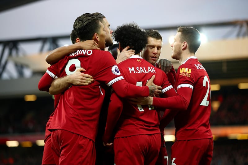 LIVERPOOL, ENGLAND - FEBRUARY 04:  Mohamed Salah of Liverpool celebrates with his teammates after scoring his sides first goal during the Premier League match between Liverpool and Tottenham Hotspur at Anfield on February 4, 2018 in Liverpool, England.  (Photo by Clive Brunskill/Getty Images)