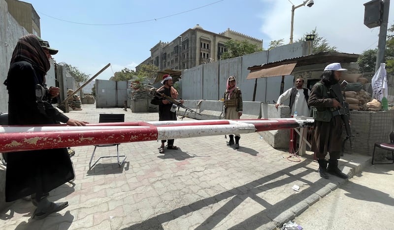 Taliban forces guard a checkpoint in Kabul. Reuters