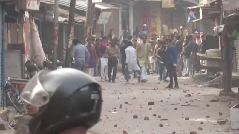 Protesters pelt stones at police personnel during clashes over citizenship law in Gorakhpur, Uttar Pradesh. Reuters