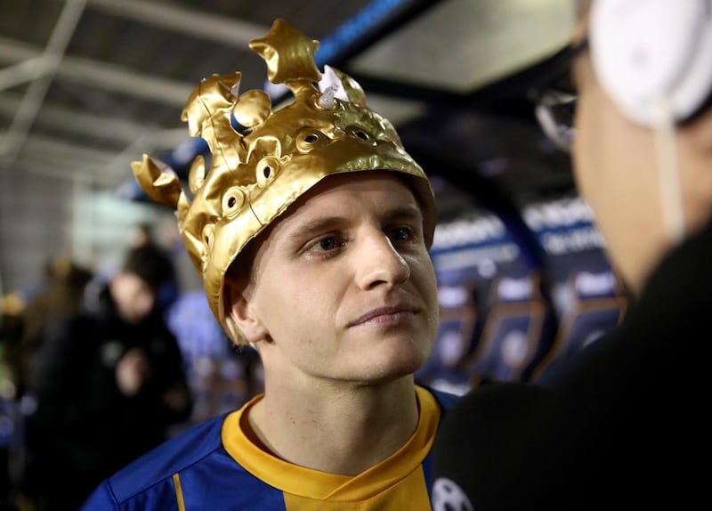 Shrewsbury Town's two-goal hero Jason Cummings wears a crown after the match. Reuters