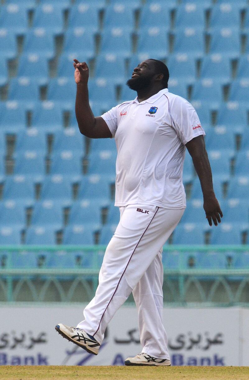 West Indies' Rahkeem Cornwall celebrates with teammates after a dismissal during the second day of the only cricket Test match between Afghanistan and West Indies at the Ekana Cricket Stadium in Lucknow on November 28, 2019. IMAGE RESTRICTED TO EDITORIAL USE - STRICTLY NO COMMERCIAL USE
 / AFP / Rohit UMRAO / IMAGE RESTRICTED TO EDITORIAL USE - STRICTLY NO COMMERCIAL USE
