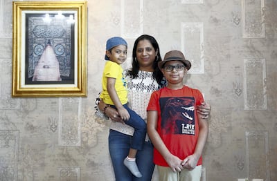 SHARJAH, UNITED ARAB EMIRATES , May 10 – 2020 :- Farheen Matheranwala with her two sons Mohammed Matheranwala (10 years old right side) and Hussain Matheranwala ( 4 years old left side) at her home in the Beach Tower 2 in Al Khan area in Sharjah. (Pawan Singh / The National) For Business. Story by Keith J Fernandez
