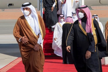 Saudi Arabia's Crown Prince Mohammed bin Salman, right, welcomes Qatar's Emir Sheikh Tamim upon his arrival to attend the Gulf Cooperation Council's 41st Summit in Al Ula, Saudi Arabia. AP