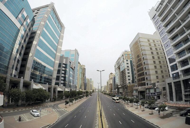 DUBAI, UNITED ARAB EMIRATES , April 11 – 2020 :-  View of the almost empty Al Maktoum road near Deira Clock tower in Deira Dubai. Dubai is conducting 24 hours sterilisation programme across all areas and communities in the Emirate and told residents to stay at home. UAE government told residents to wear face mask and gloves all the times outside the home whether they are showing symptoms of Covid-19 or not. (Pawan Singh/The National) For News/Online/Instagram/Standalone