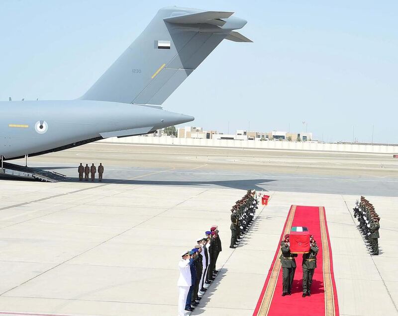 The body of one of the 45 Emirati martyrs arrives at Al Bateen Airport in Abu Dhabi after the completion of identification procedures in Saudi Arabia. Wam