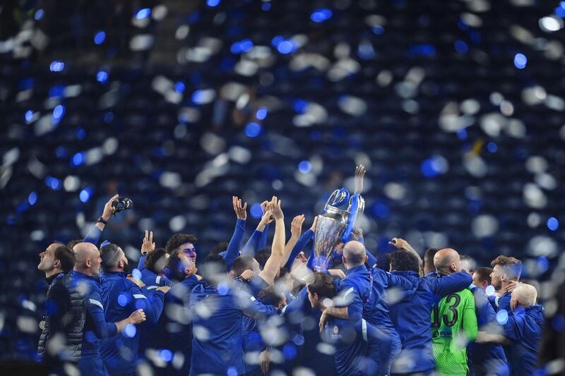 Chelsea's players celebrate with the trophy after beating Manchester City to win the Champions League final at the Dragao stadium in Porto on Saturday, May 29. AFP