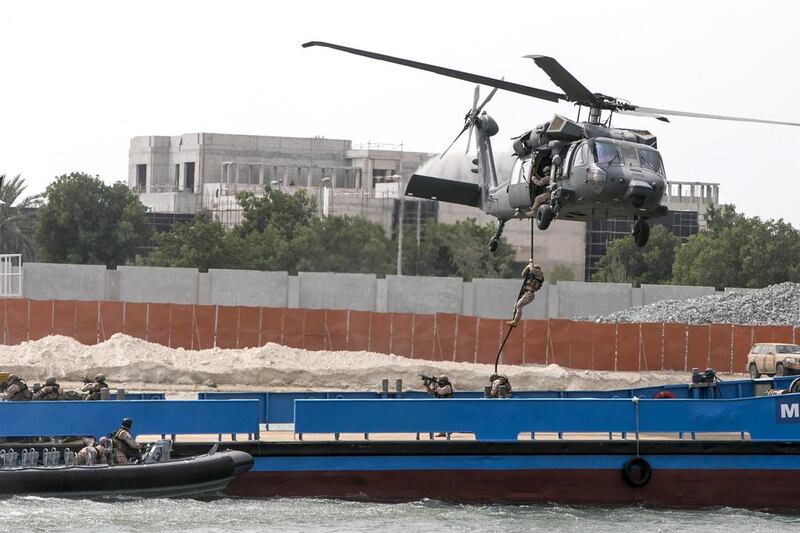 The UAE armed forces show their skills during the opening day of Idex in Abu Dhabi. Silvia Razgova / The National