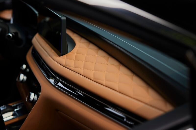 The Japanese-influenced interior includes plush leather details.