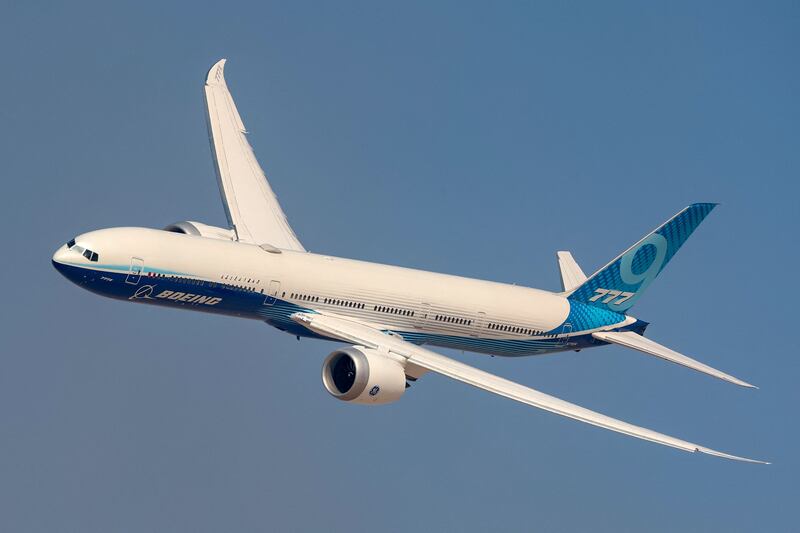 A Boeing 777X aircraft flies during the Dubai Airshow 2023 at Dubai World Central - Al-Maktoum International Airport.  AFP